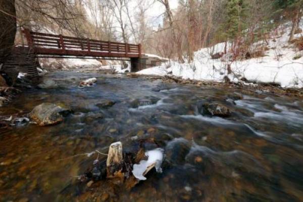 Water runs out of Tibble Fork Reservoir in American Fork Canyon on Tuesday, Feb. 1, 2022.