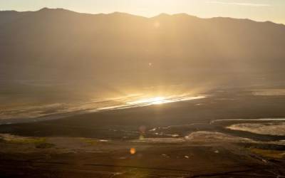 The rising sun reflects off of pools of water and brine that are part of the Owens Lake Dust Mitigation Program on the mostly dry lakebed in Inyo County, California, on Friday, Aug. 12, 2022. Spenser Heaps, Deseret News