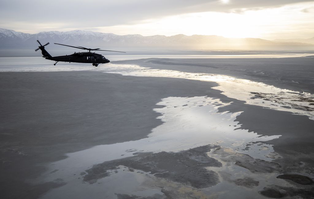 (Scott G Winterton | Pool) A Black Hawk helicopter flies over the Great Salt Lake as Utah lawmakers take an aerial tour of the Great Salt Lake with the Utah National Guard on Tuesday, Feb. 15, 2022.