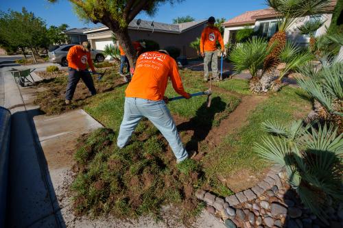 (Trent Nelson | The Salt Lake Tribune) Workers with Foxtail Turf remove the grass from Patricia Council's North Las Vegas yard, replacing it with artificial turf on Thursday, Sept. 29, 2022.