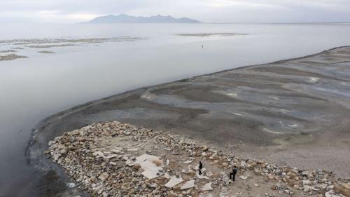 Tourists visit the Great Salt Lake on Nov. 19, 2021. The lake officially hit its lowest levels ever in October 2021. (Laura Seitz, Deseret News)