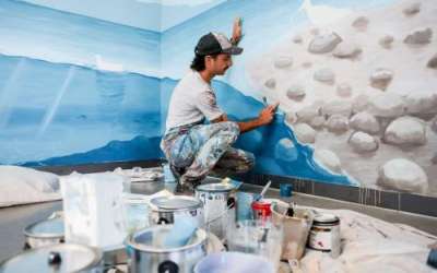 Argentinian artist Franco Cervata Cozza, who also goes by the artist name Vato, paints a mural at the George S. and Dolores Doré Eccles Wildlife Education Center in Farmington on Saturday. (Photo: Spenser Heaps, Deseret News)