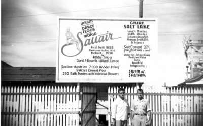This photo from 1930 shows a promotional sign at Saltair. In 1893 the Church of Jesus Christ of Latter-day Saints built Saltair on the south shore of the Great Salt Lake, sixteen miles from downtown Salt Lake City, Utah. It was sold to a private individual in 1906. The main attraction was swimming in the Great Salt Lake. There was also a roller coaster, a merry-go-round, a ferris wheel, midway games, bicycle races, touring vaudeville companies, rodeos, bullfights, boat rides on the lake, firework display and even hot-air balloons. In 1925 it burned to the ground. A new pavilion was designed and built but it never regained its popularity. It closed for good in 1958. It was again destroyed by fire in November of 1970. Photo used by permission, Uintah County Library Regional History Center, all rights reserved.